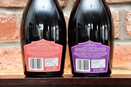 Photo of the back of the labels of one bottle of Renegade and Longton blush elderflower and rhubarb sparkling wine and one bottle of Pure elderflower sparkling wine